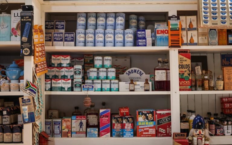 A vintage shop shelf featuring retro packaging of various products and medicinal items.