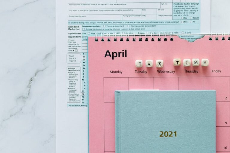April calendar with tax forms, highlighting tax time reminders for financial tasks.